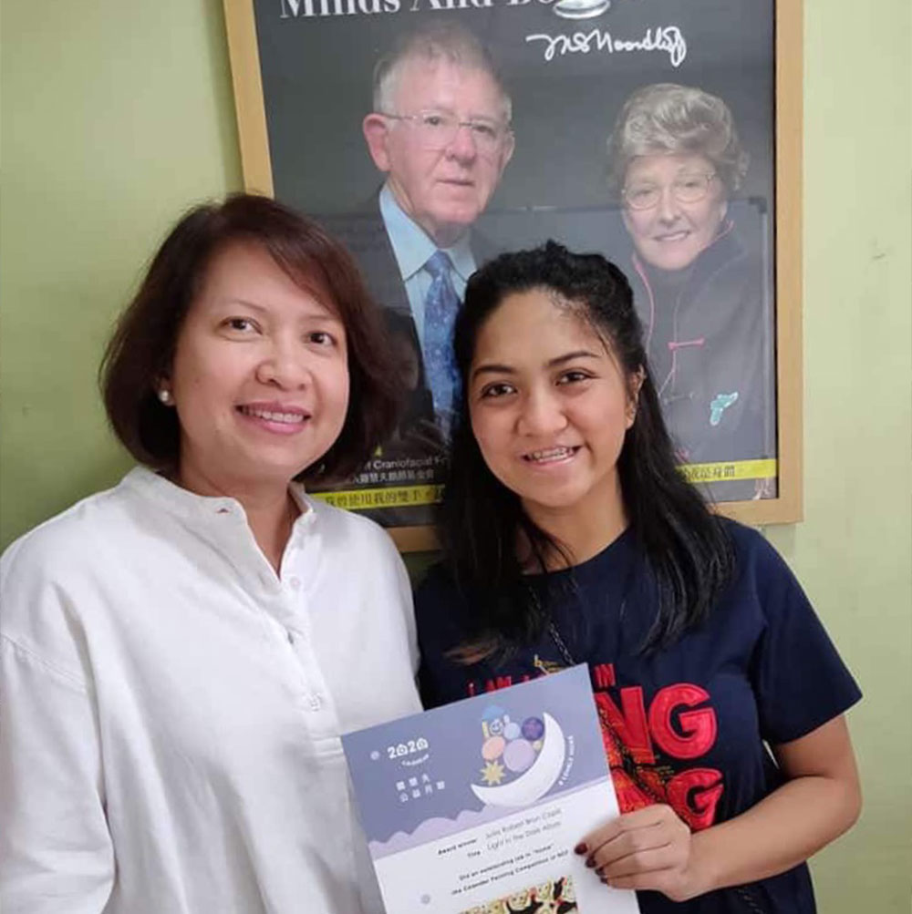 Julia Capili smiling with Dr. Janet Pandan at Noordhoff Craniofacial Foundation of the Philippines