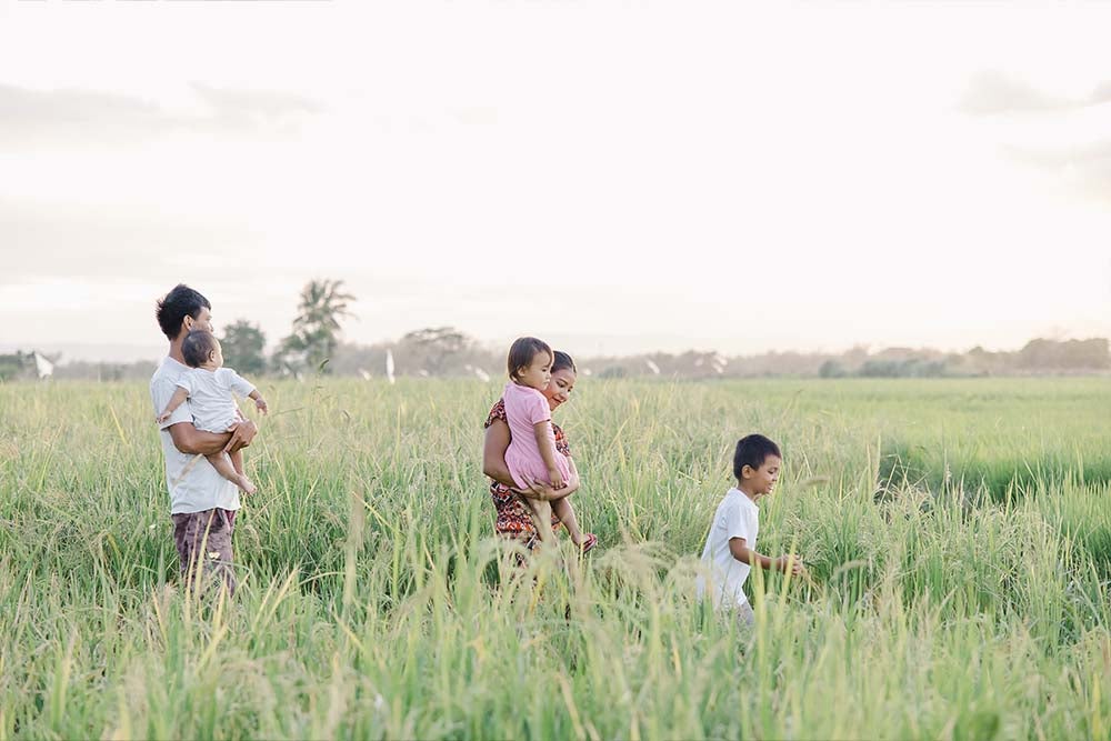 Desiree, her husband, and her children go for a walk