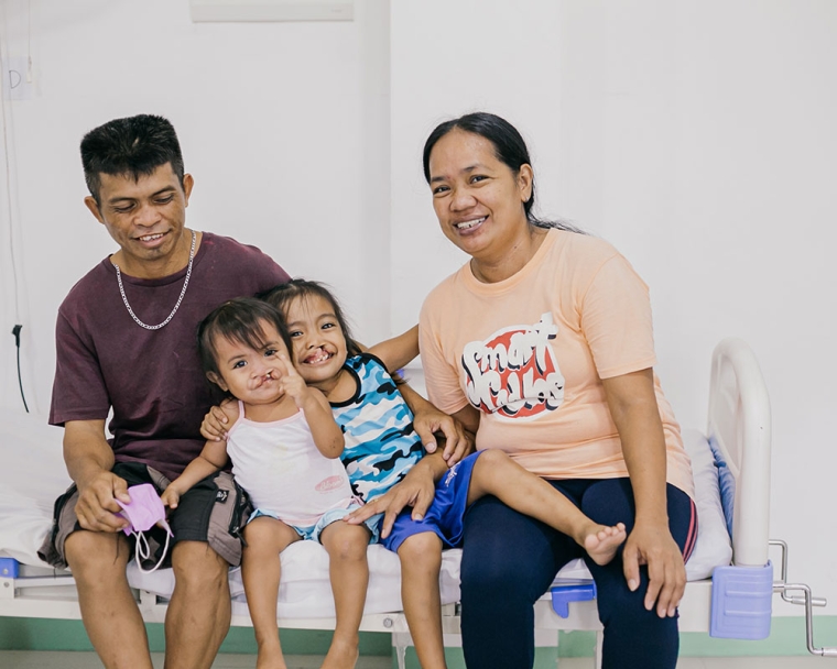 Pacatang family smiling before cleft surgery