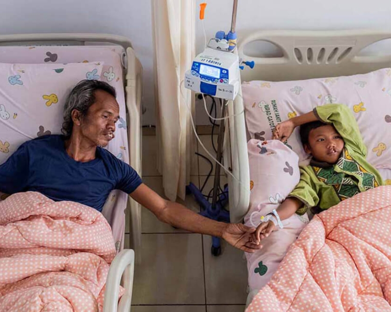 Alim and Rajib in hospital bed